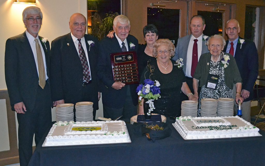 Hall of Fame members pose with CONY 50th cake