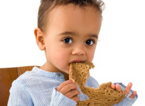 toddler with bread