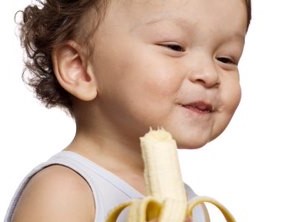 kid eating banana