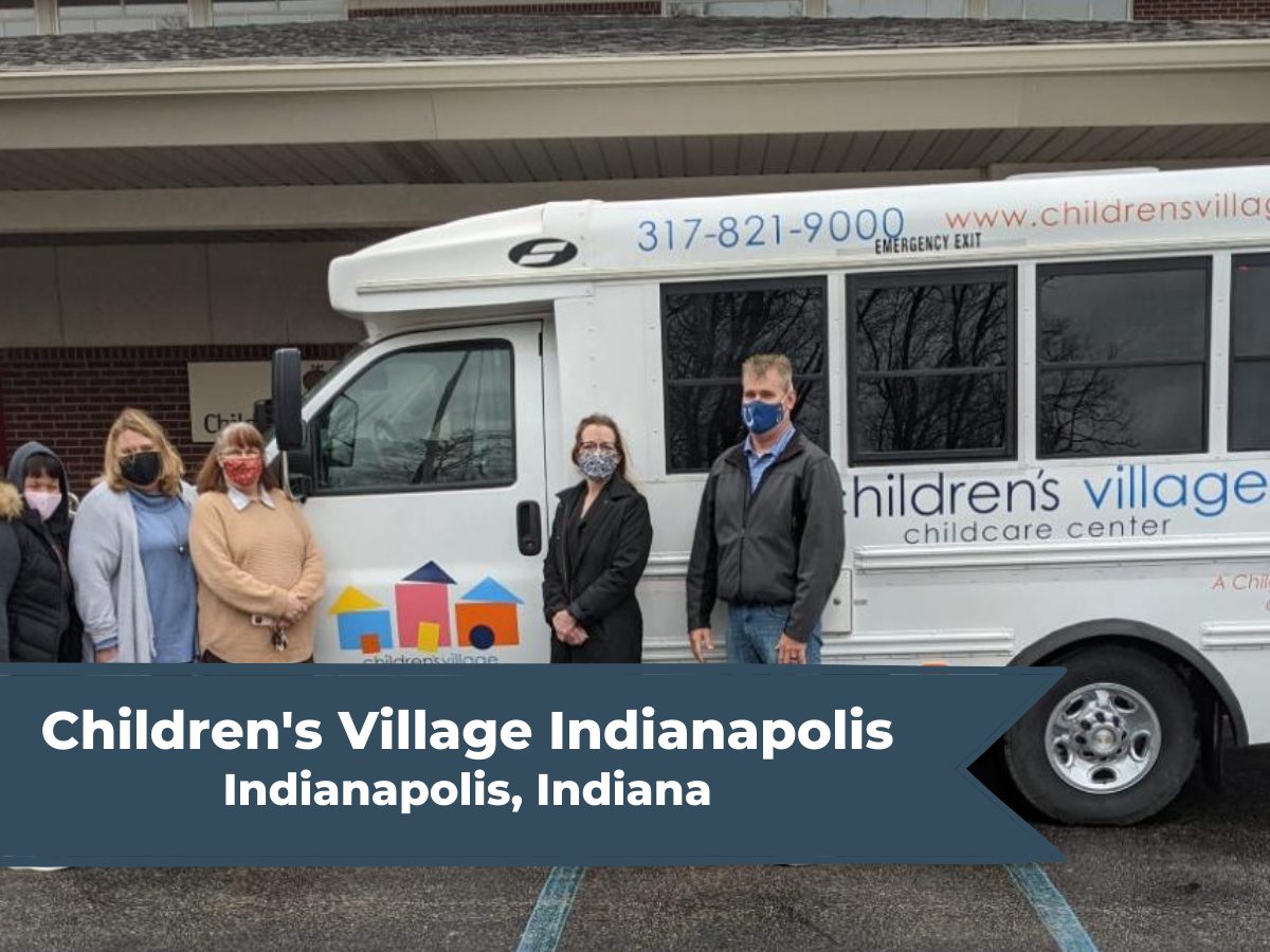Children's Village staff standing in front of new minibus