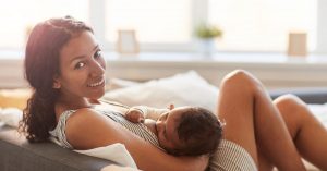 Southeast Asian woman breastfeeding infant