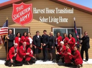 Redcoats attend ribbon cutting at the Salvation Army Harvest House Transitional Sober Living Home