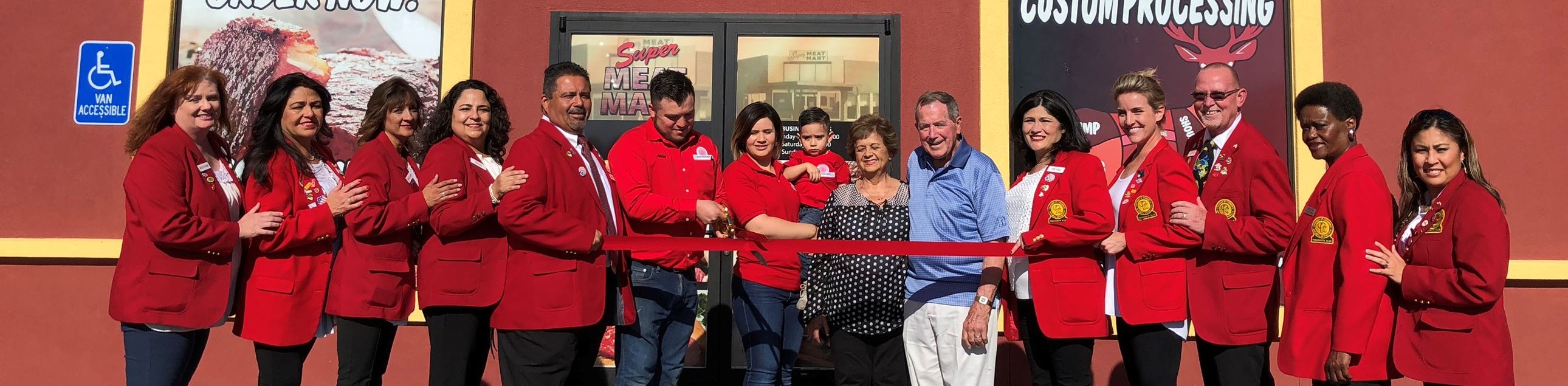 Redcoats attend ribbon cutting event at Super Meat Mart