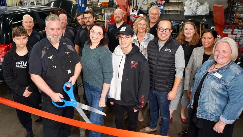 Bob & Lydia Elder cutting the ribbon at Brian's General Auto Service as new owners. They are joined by members of the Brain's Auto team, local dignitaries and supportive family and friends.