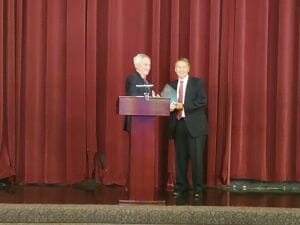two men at the podium