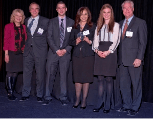 Teresa Amaro pictured with her 250 South Wacker Drive property management team. Susan Hammer, left, TOBY Subcommittee Co-Chair and George Kohl, right, President of BOMA/Chicago.