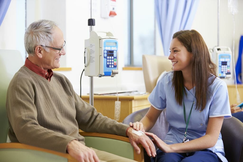 Senior Man Undergoing Chemotherapy With Nurse Senior Man Undergoing Chemotherapy With Nurse