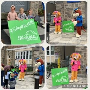 Shop the hills mascot and sign pictured with halton hills residents.
