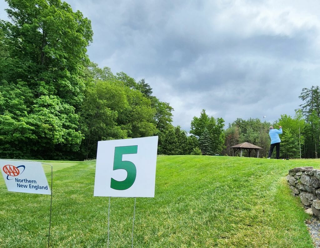 BIA Board President John Kacavas, counsel with Hinckley Allen, tees off on the fifth hole at the Concord Country Club Monday during BIA’s annual golf tournament.