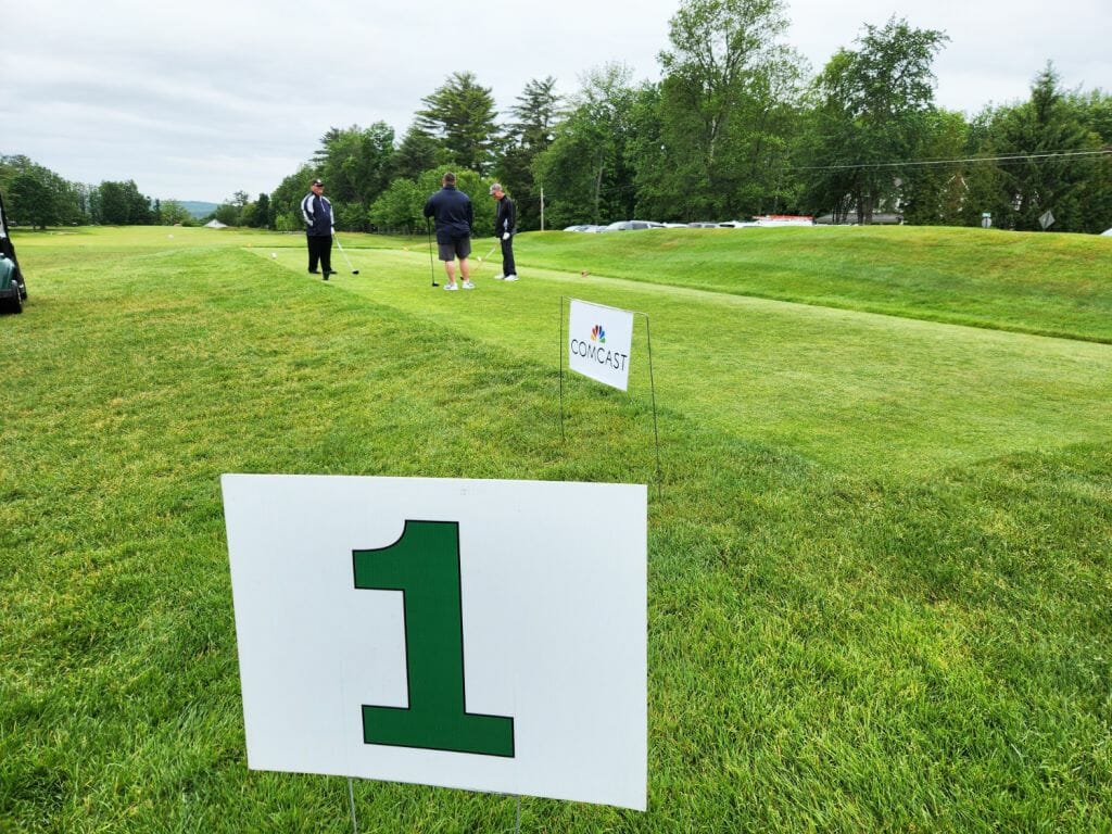 A team awaits the starting horn on the first hole at the Concord Country Club for the 28th annual BIA Golf Classic, presented by Comcast, on Monday.