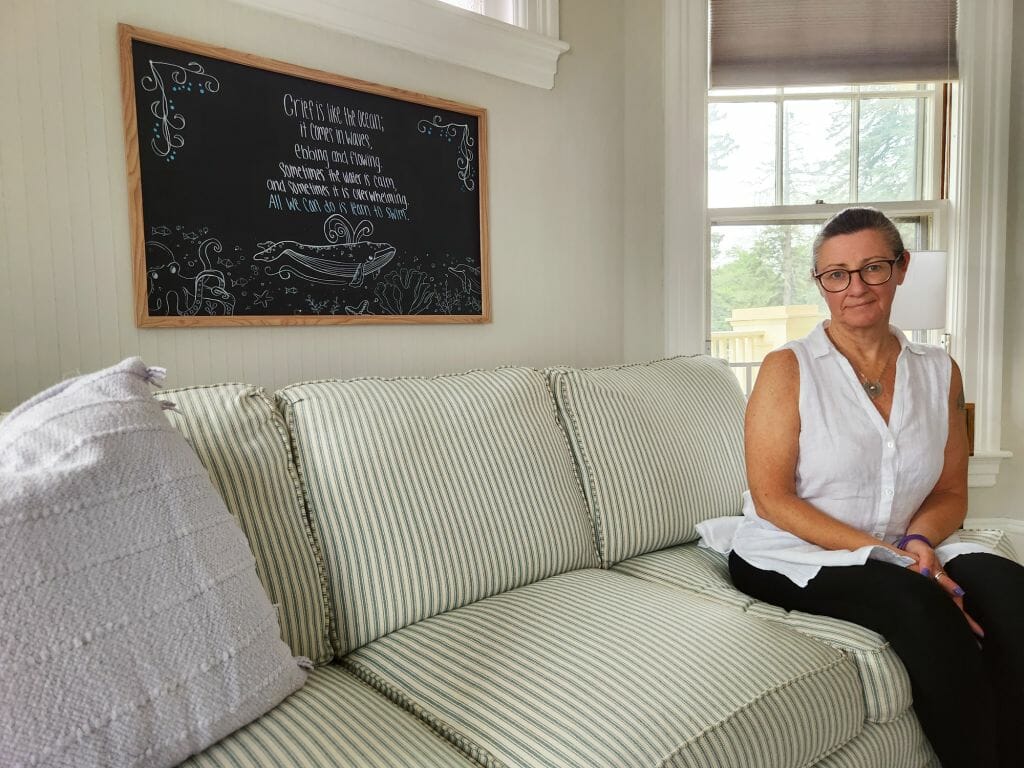 Christine Phillips, cofounder and executive director of Friends of Aine, sits inside the agency’s Center for Grieving Children &amp; Families in Manchester. Friends of Aine provides grief support services for children and families through a peer-to-peer based approach. (Courtesy photo)