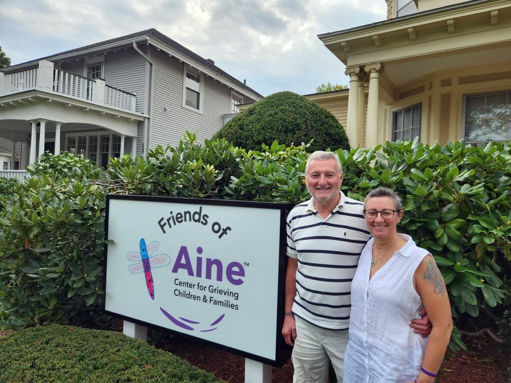Christine and David Phillips, cofounders of Friends of Aine, stand outside the agency’s Center for Grieving Children &amp; Families in Manchester. Friends of Aine’s mission is to help children and families grieving a death navigate their path to a hopeful future. Services are offered at no cost to families thanks to the generosity of donors. (Courtesy photo)