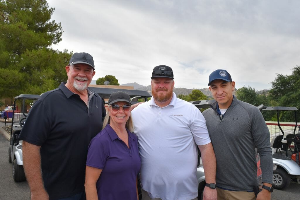 team of 4 at Golf tournament