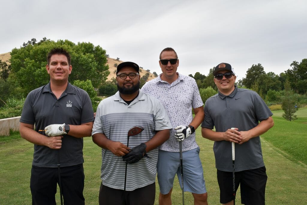4 guys at Golf tournament