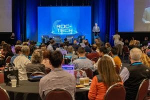 A photo of the audience at the 2023 ROC on Tech conference with Bob Duffy speaking