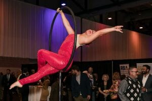An aerialist performs at the 2023 Greater Rochester Chamber Top 100 Awards