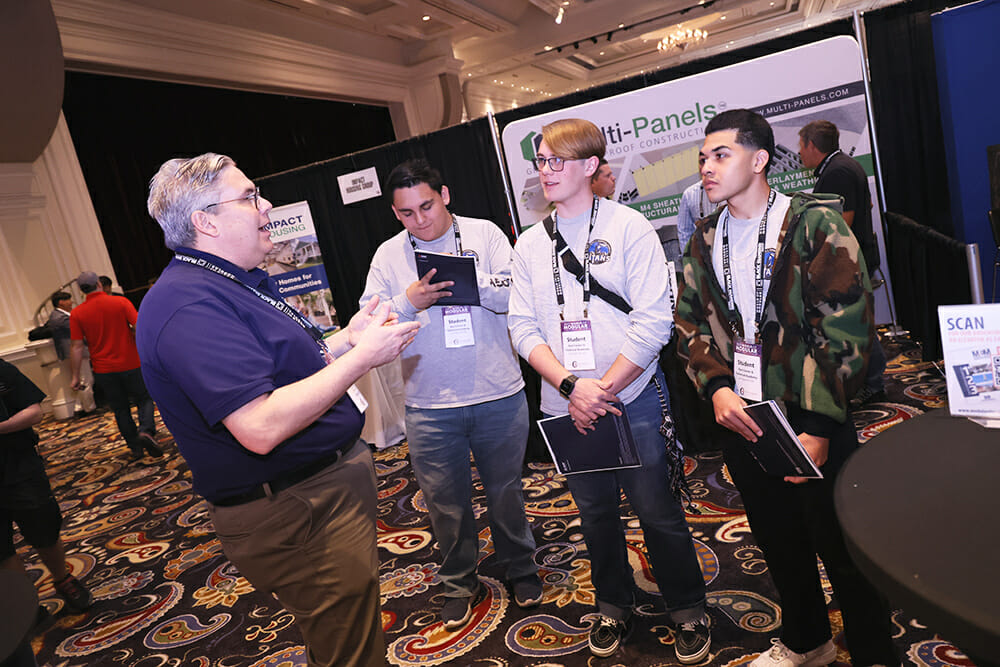 Students from East Career & Techincal Academy in Las Vegas your the exhibit hall at the 2023 World of Modular