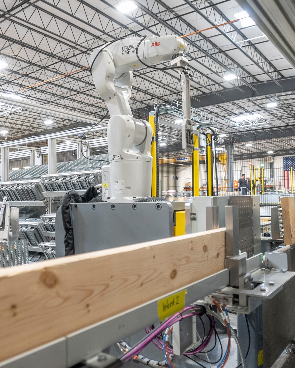 A house of Design-programmed robot helps prepare assemblies for a modular building.