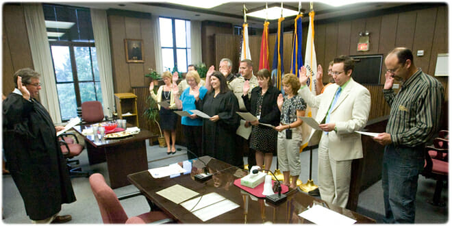 Judge L. Edward Stengel, Sheboygan County Circuit Court, swore in members of the county's new veterans court program in August 2012. The group included Judge Angela W. Sutkiewicz, who presides in the court. Photo credit: Sheboygan Press