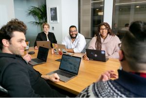Group of people in a meeting around a conference table