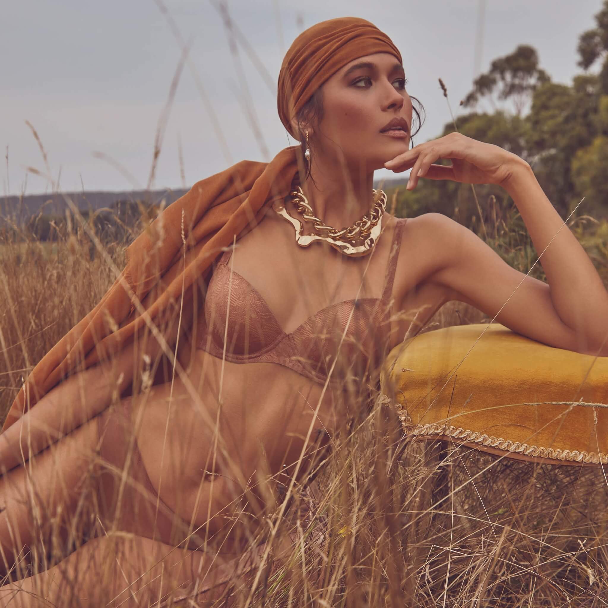 woman reclining and posing outdoors