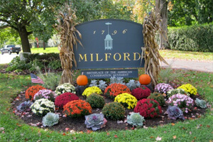 Secret Garden Club Milford sign with flowers