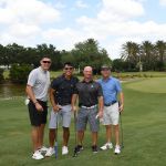 4 men golfing