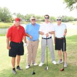 4 men golfing