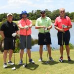 4 men golfing