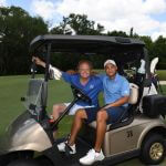 2 men in a golfcart