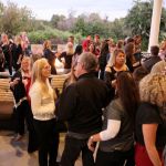 people outside at an event talking