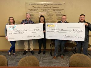 bridges presentation 2023 The Moore Chamber of Commerce Women’s Impact Network and Leadership Moore Alumni together donated $1,700 to their 2022 community partner Bridges of Moore. Pictured from left are Katelyn Dockery, Zach Smith, Catherine Landros, Mike Smith and Gareth Williams.