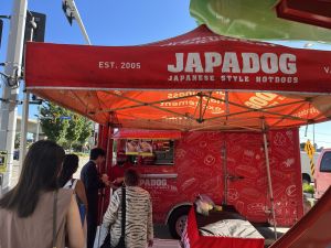 People waiting in line for Japadog food truck at a Buinsess After 5 networking event