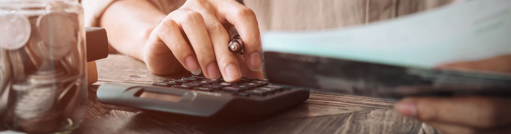 cost of living hand and calculator