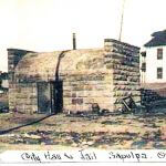 1904 Sapulpa Jail. Building in background is Dewey College. Creek County Courthouse now stands