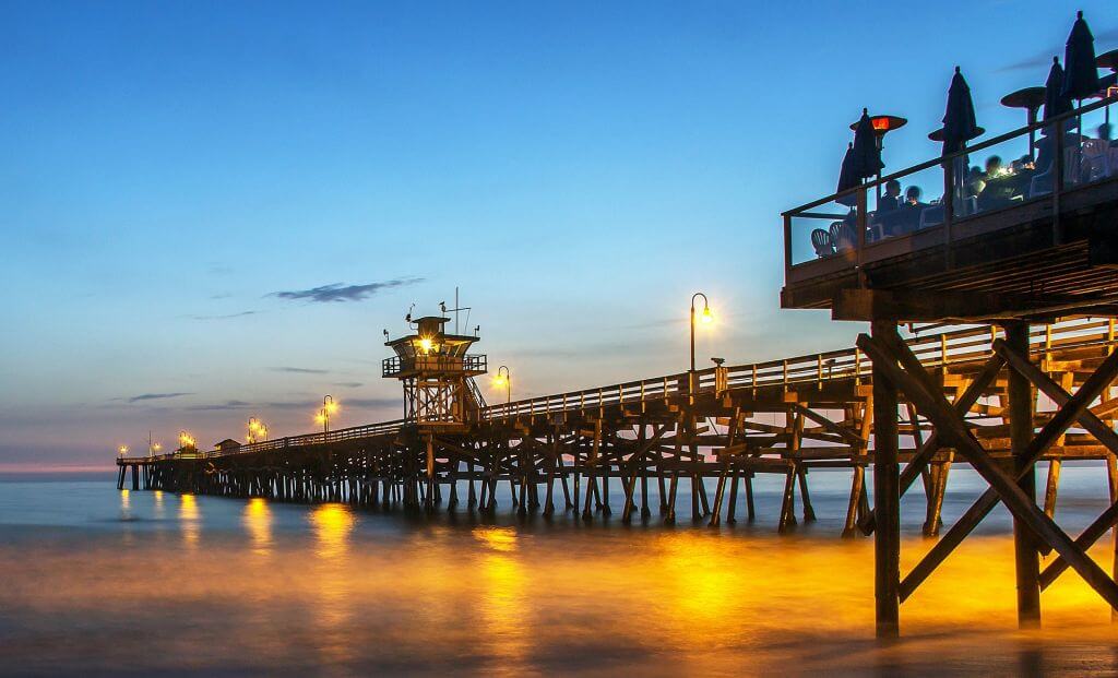 pier lit up at night