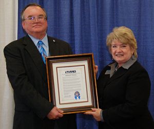 Mike Winsky receiving the Carl E. Lee Broadcast Engineering Excellence Award from MAB President/CEO Karole White in 2012.