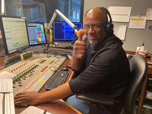 WWJ's Tony Ortiz delivers a thumbs-up to listeners for their contributions to the THAW Radiothon.