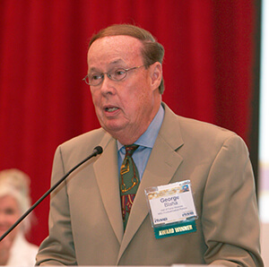 George Blaha in 2014 accepting his induction into the Michigan Broadcasting Hall of Fame.
