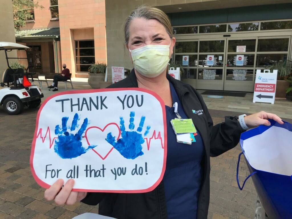 volunteer appreciation luncheon nurse with sign