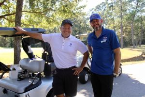 2 men with golf cart