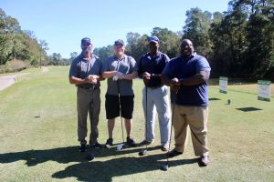 team at putt pass and chip event