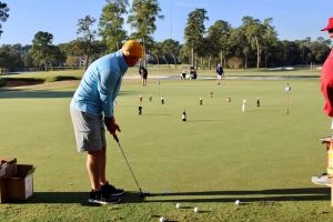 man putting at putt pass and chip event