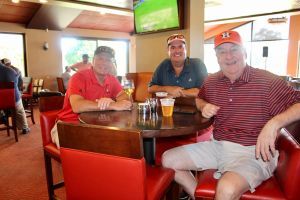3 men at putt pass and chip event