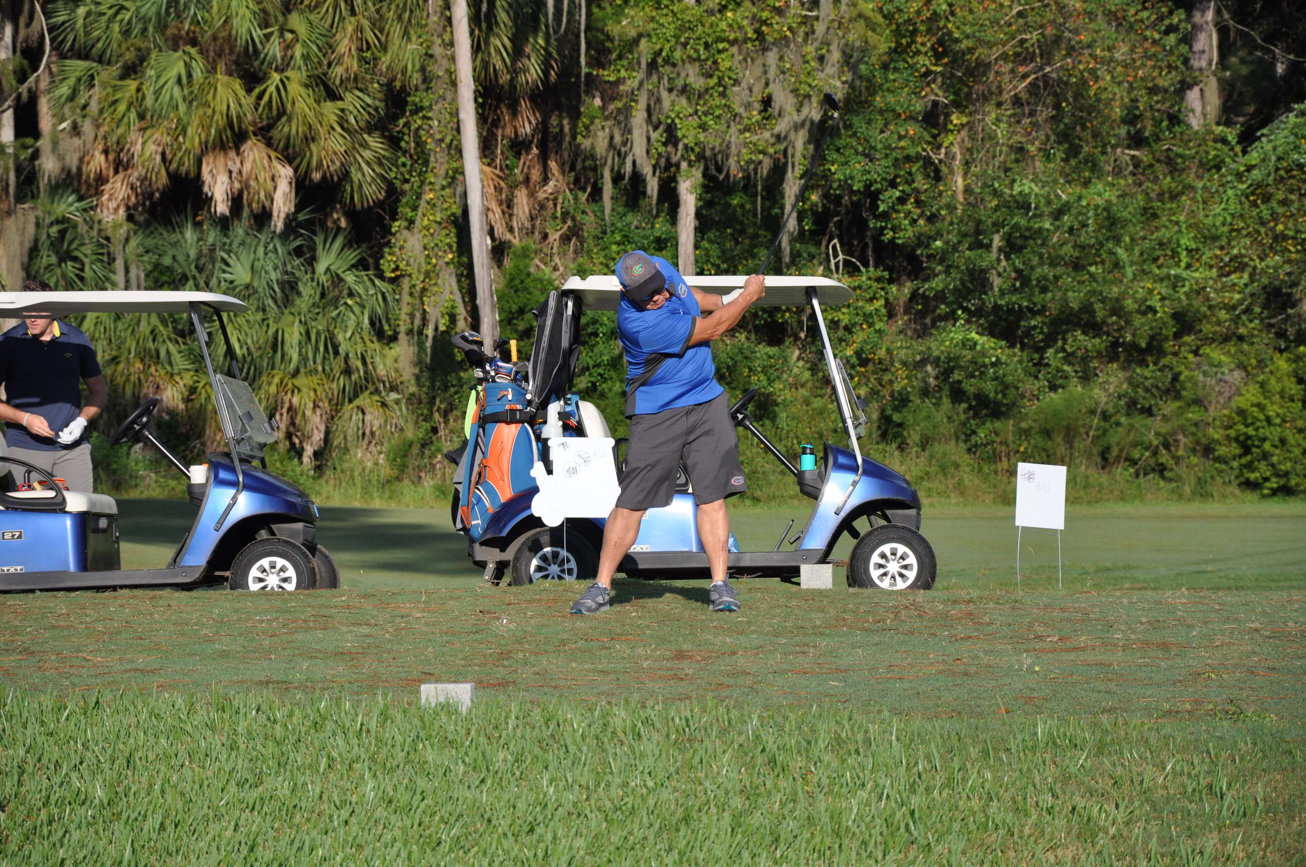 man swinging a golf club