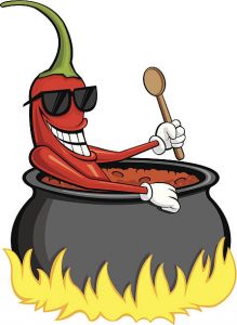This is a chili pepper sitting in a pot of boiling hot chili holding a wooden spoon.