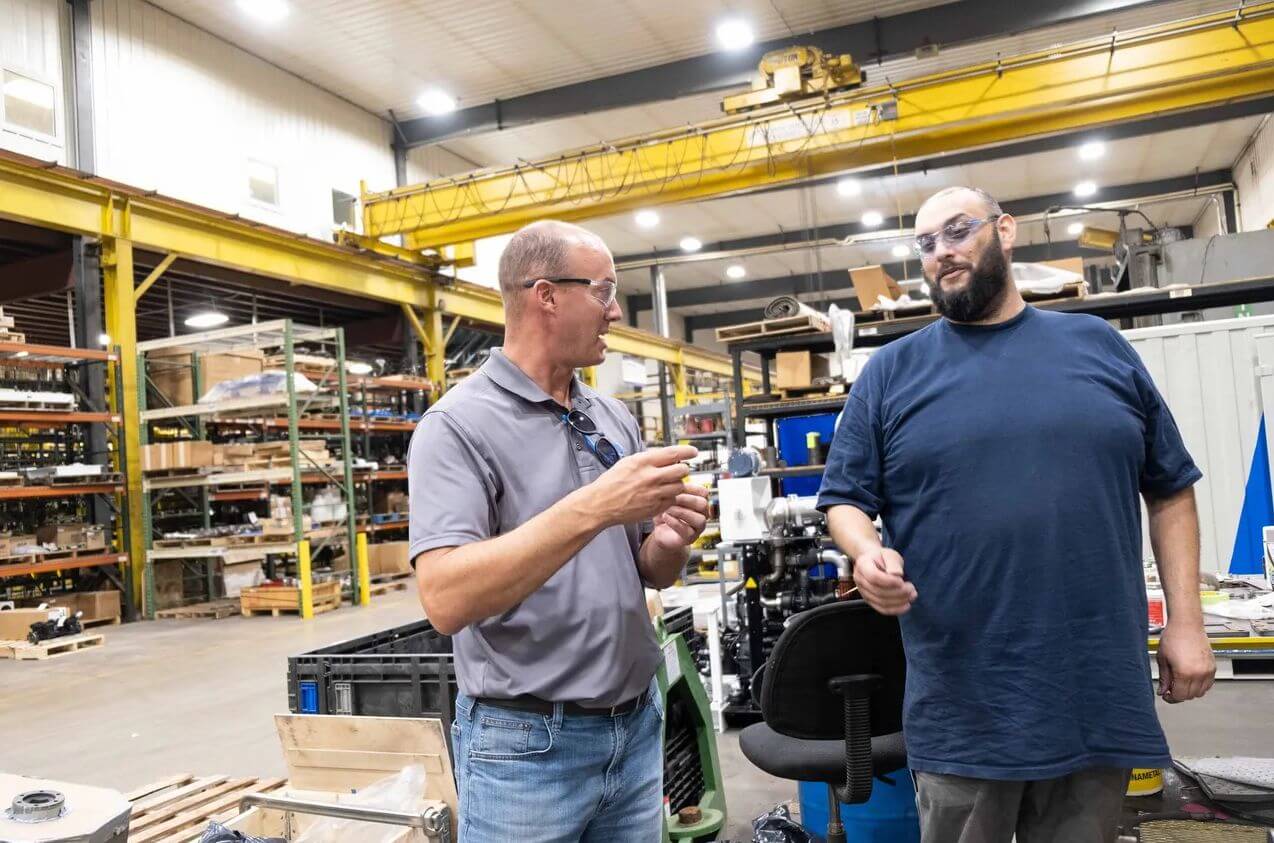 2 men in warehouse