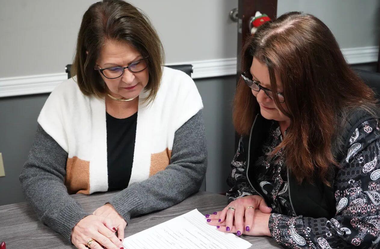 2 women going over paperwork