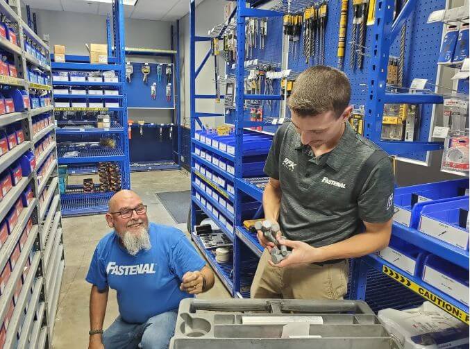 2 men sorting nuts and bolts