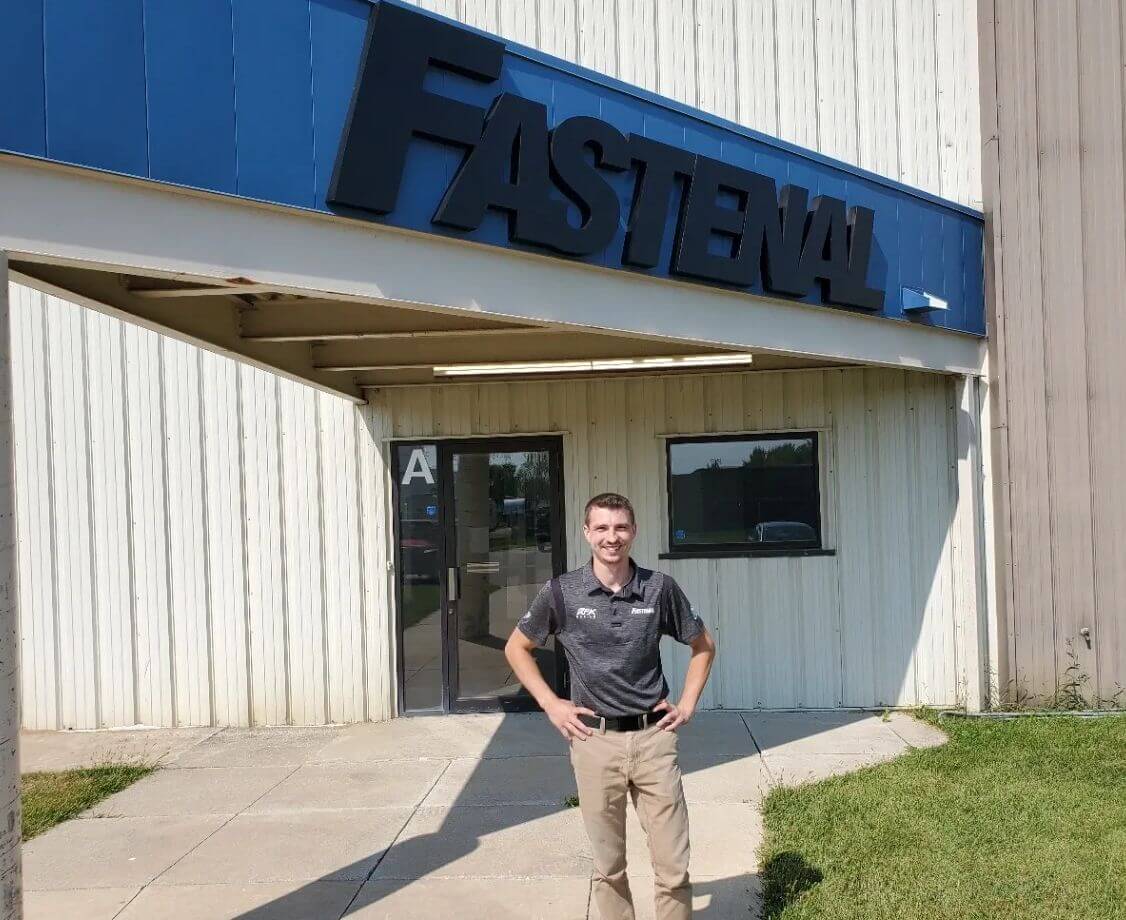 man in front of fastenal store